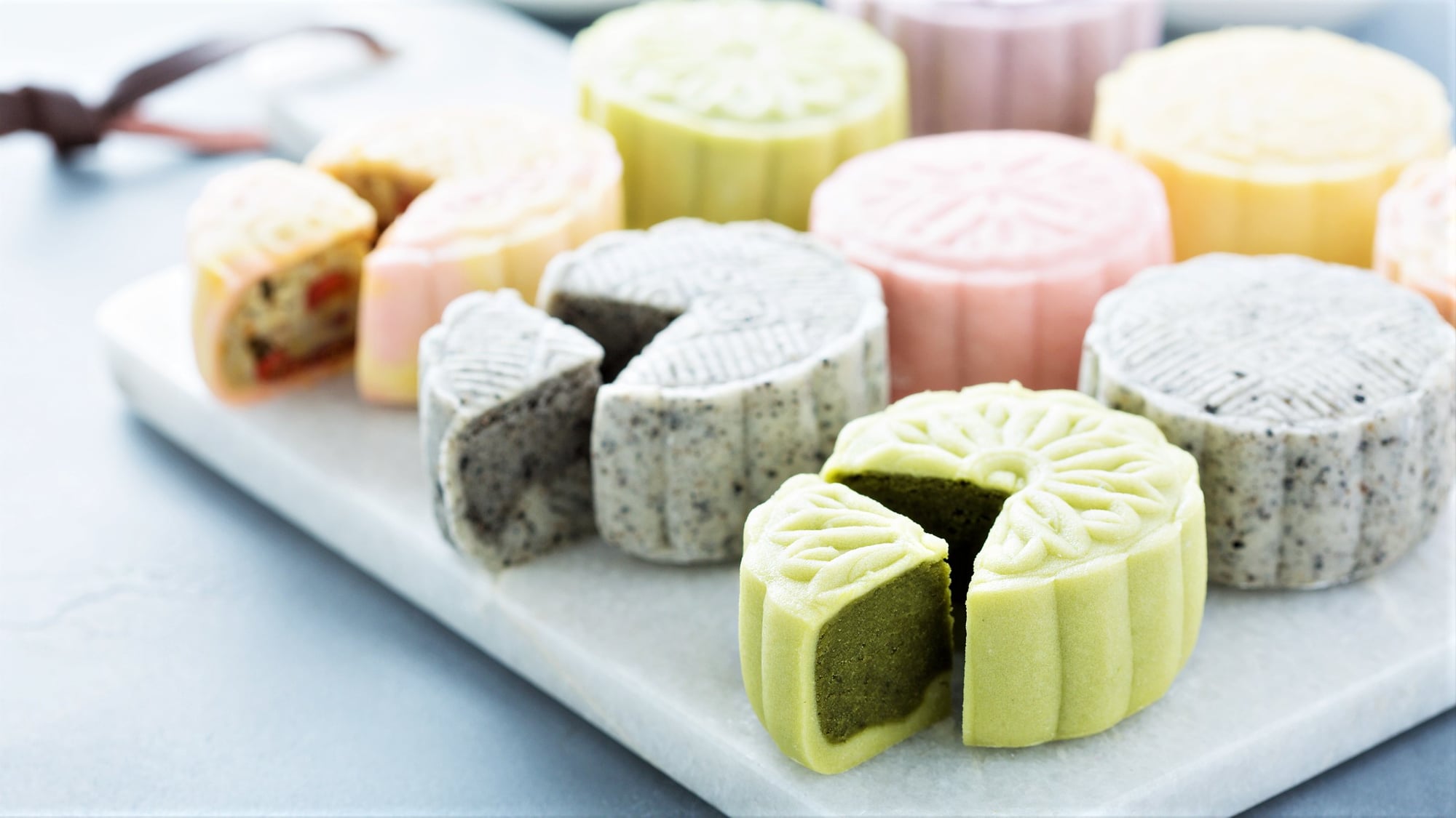 Neatly arranged snowskin mooncakes of different colors